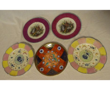 A pair of Victorian Staffordshire pottery circular plates with shell decoration within purple borders, 19th Century plate wit