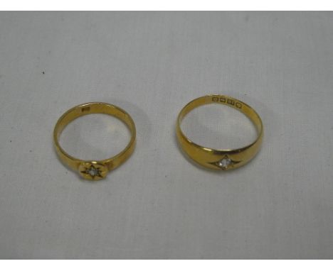 An 18ct gold gypsy-style dress ring set a single diamond and one other 18ct gold ring set a diamond (2)