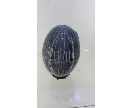 Art pottery egg on metal stand 