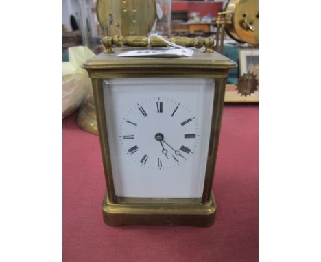 A Brass Carriage Clock, circa 1900, with bevelled glass panels, including oval to top, visible movement, sticking on a gong, 