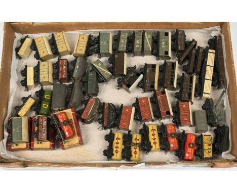 Trix TTR Pre / Immediate Post War group on mainly unboxed wagons. To include SR closed vans; "Esso" tank wagons; LMS cattle t