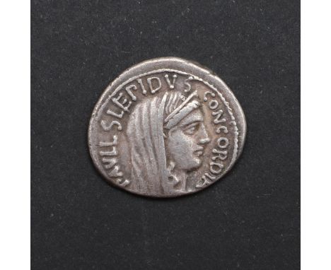 Aemilius Lepidus Paullus, 62 BC, veiled and diademed head of Concordia r. Reverse togate figure of L. Aemilius Paullus, troph