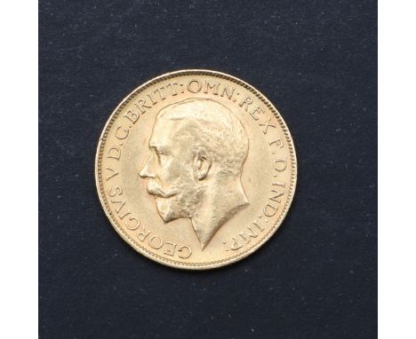 A George V Sovereign, bare headed bust l. reverse George and the Dragon, with SA to the ground for the Pretoria Mint. Dated 1