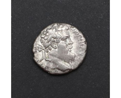 A silver denarius, obverse with laureate bust r. Reverse with Ops enthroned. 3.11g. Enthroned on New Year's day 193 but his a