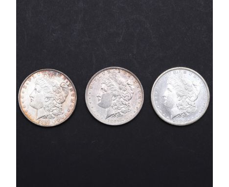 Three United States of America Morgan Dollars, 1880 (s), 1881, and 1887. 3 coins. *CR Light surface marks only, third with at