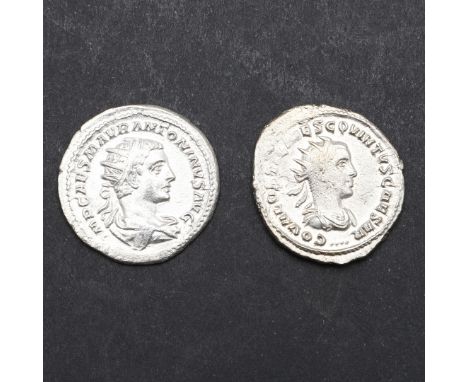 A silver Antoninianus. Reign of Elagabalus, radiate, draped and cuirassed bust r. Reverse Roma seated on a shield holding Vic