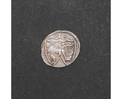 A Commonwealth period penny, obverse with shield within a wreath, reverse with I above two shields. 1649-60. 0.47g. *CR A rea