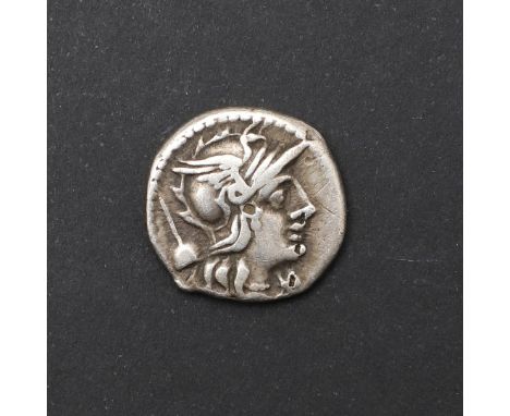 A Roman Republic Denarius. T. Quinctius Flamininus. Helmeted head of Rome, apex behind and XVI monogram below the chin. Rever