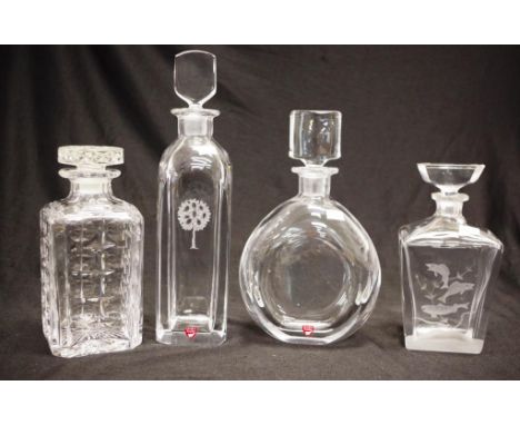 Four various cut crystal decanter comprising 3 Orrefors including one round decanter, one with etched tree motif, and one wit