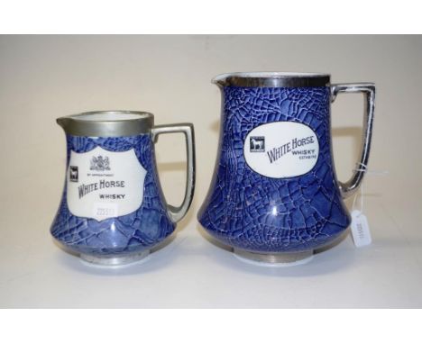 Graduated pair Shelley 'White Horse' whisky jugs each jug marked for 'White Horse' Scotch whisky, on blue ground, (smaller ju