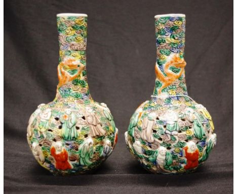 Pair Chinese decorated ceramic vases each with in relief figural decoration, to pierced bowls, character marks to bases, (hei