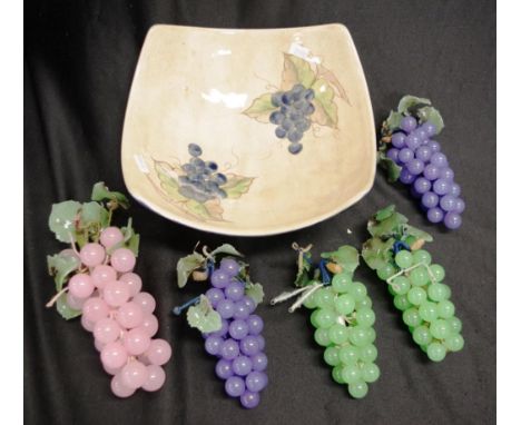 Five Chinese hard stone bunches of grapes in various collars, in a ceramic grape decorated bowl