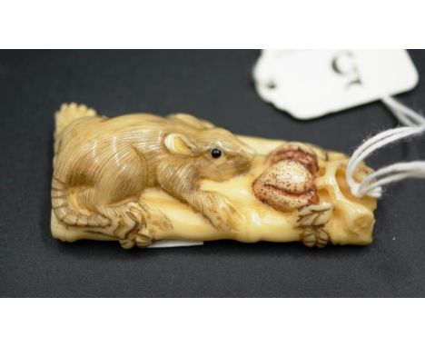 Japanese rat on bamboo raft carved netsuke signature to base, 6cm length approx.