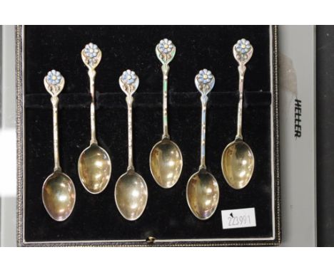 Cased set six Elizabeth II silver teaspoons Birmingham 1958, makers Turner &amp; Simpson, each of silver gilt, with enamel de