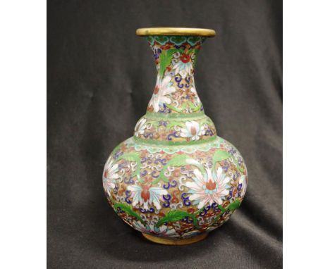 Chinese cloisonne decorated table vase extensive enamel blossom decoration on green ground, (height 21cm approx).