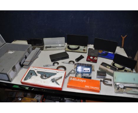 A COLLECTION OF MEASURING TOOLS to include micrometres, callipers, dial callipers, dial gauges, combination square etc compri