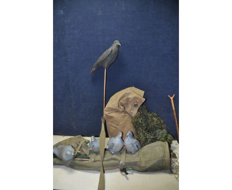 HUNTING EQUIPMENT to include a camouflage sheet with support poles along with five pigeon decoys and a crow decoy in military