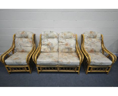 A WICKER THREE PIECE CONSERVATORY SUITE, comprising a two seater sofa, length 130cm, and two armchairs (condition - signs of 