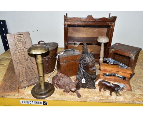 A COLLECTION OF TREEN AND CARVED WOOD,  comprising an African Art tribal bust of a female, two water buffalo, a 1973 Tiger II