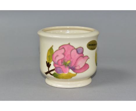 A SMALL MOORCROFT POTTERY JARDINIERE, decorated in Magnolia pattern on a cream ground, impressed marks to base, foil Moorcrof