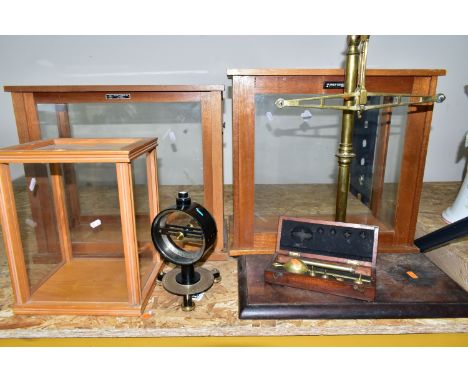 A GROUP OF BALANCE SCALES AND EMPTY GLASS CASES, comprising a wooden cased saccharometer No. 4073 by Ash &amp; Son, part of a