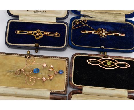 THREE EARLY 20TH CENTURY BROOCHES AND A LAVALIER PENDANT, the first a floral seed pearl bar brooch with milgrain detail, fitt
