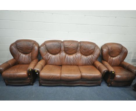 A BROWN LEATHERETTE THREE PIECE SUITE, comprising a three seater sofa, and two armchairs (condition - stains to head rests)