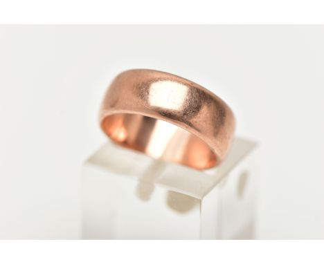 A WIDE ROSE METAL BAND RING, polished band, approximate band width 6.6mm, ring size leading edge J, approximate gross weight 