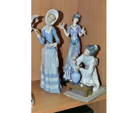 TWO LLADRO FIGURINES AND ONE OTHER, comprising 'Lady With Umbrella',  'Oriental Girl' 4840 and an unnamed Art Deco style lady