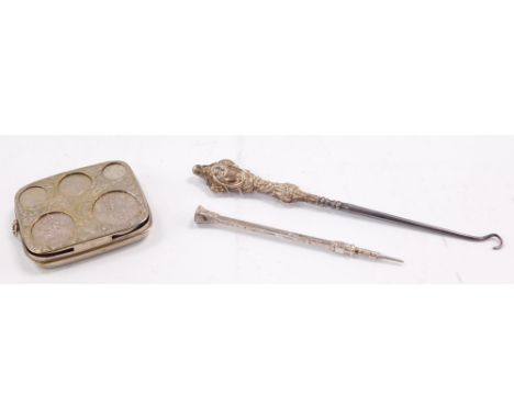 A silver plated coin case, contained some coins, a silver mounted button hook, and an engraved propelling pencil.