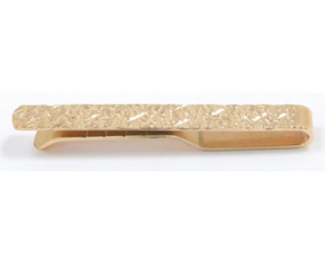 A 9ct gold tie clip, with bright cut engraving, 4.1g.