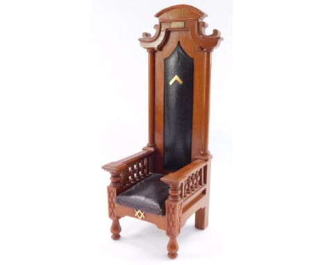 A Masonic light oak model of a Doric highchair, with leatherette seat and back, plaque named to H J Kelly P.D.G.W., WM1912, 1