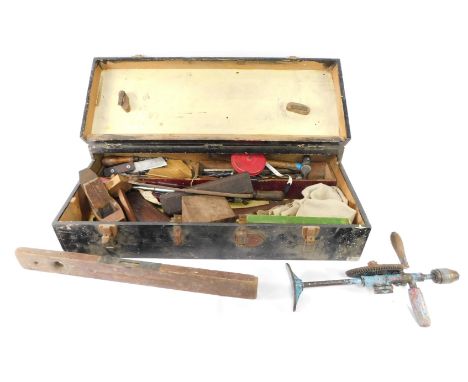 A carpenter's tool chest, including level, chisels, saw, block plane, Clipper drill, etc. 