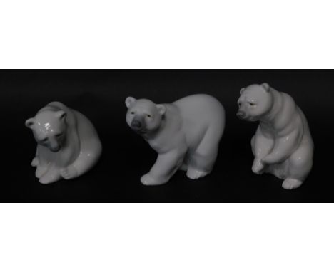 Three Lladro porcelain figures modelled as Polar bears, in various poses, 10cm high.