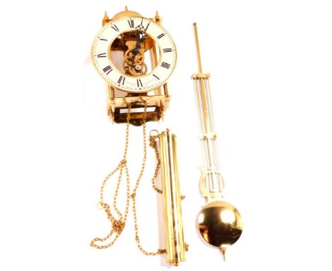 A Sewills of Liverpool brass cased skeleton lantern wall clock, circular dial with chapter ring bearing Roman numerals, singl