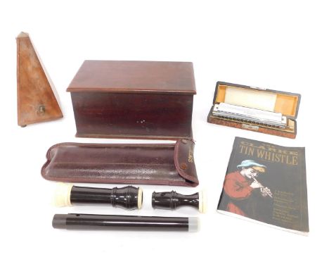 A group of items to include a Paquet metronome, a Hohner 64 Chromonica in fitted case, a mahogany box, and a recorder.