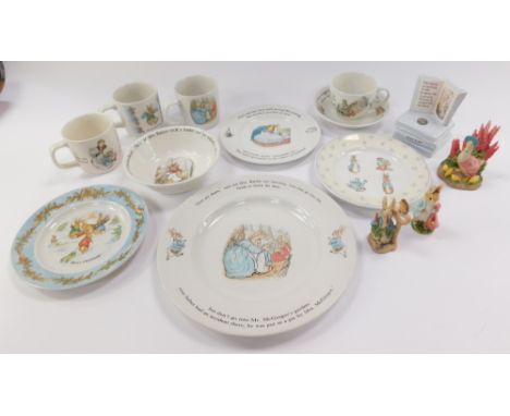 A group of Wedgwood Beatrix Potter table wares, to include plates, cups, and bowls, together with two figures. (a quantity)