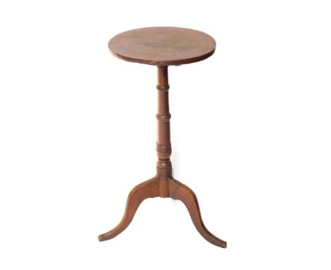 A 19thC oak wine table, the circular top on a turned column and tripod base, the top 36cm diameter.