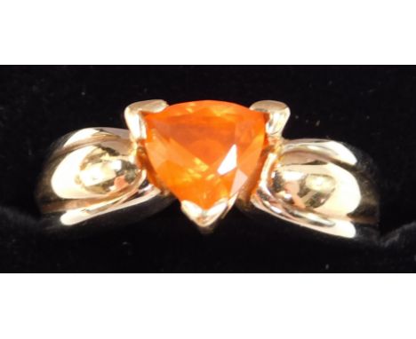 A fire opal ring, trilliant cut, set in yellow metal stamped 14k, approximately 1ct, size M, 6.60g.