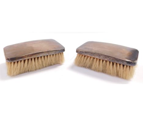 A pair of George VI silver backed hair brushes, with engine turned decoration, shield reserve, Birmingham 1937.