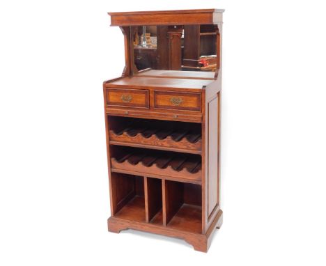 A modern oak and elm drinks serving buffet, with mirror back, two drawers and slide over wine rack and compartmental base on 