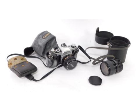 A Canon AE-1 camera, with lens, and a Miranda 55mm lens. 