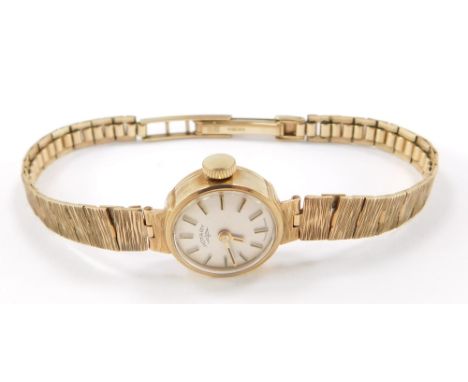 A lady's 20thC 9ct gold Rotary cocktail wristwatch, having cream dial with applied stick markers and pencil hands, with knurl