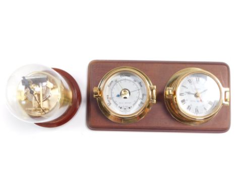 A Royal Mariner brass two dial wall clock and barometer, the clock with quartz movement, the case of porthole form on a woode