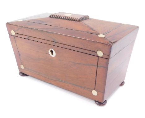 A Victorian rosewood sarcophagus tea caddy, with mother of pearl inlay, raised on bun feet, 23cm wide.