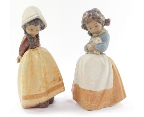 Two Lladro figures modelled as children, 21cm high.