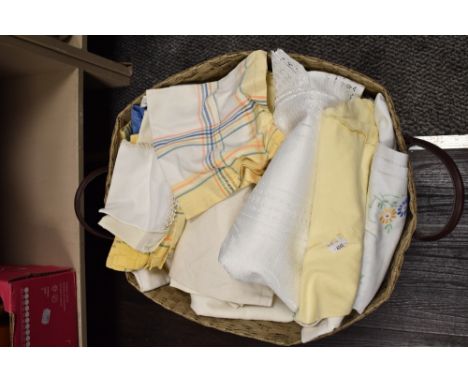 A hamper of vintage and retro table linen.