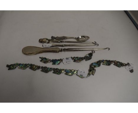 A selection of curios including lady golf spoon, Hm silver handle button hooks and Mexican silver and mother of pearl bracele