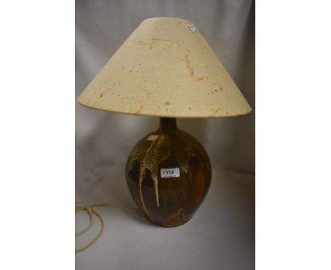 A mid century studio pottery lamp base with drip glaze, and naturalistic matching shade
