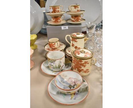 A Japanese partial coffee set having russet leaf pattern with gilt detailing, also included are two egg shell cups and saucer